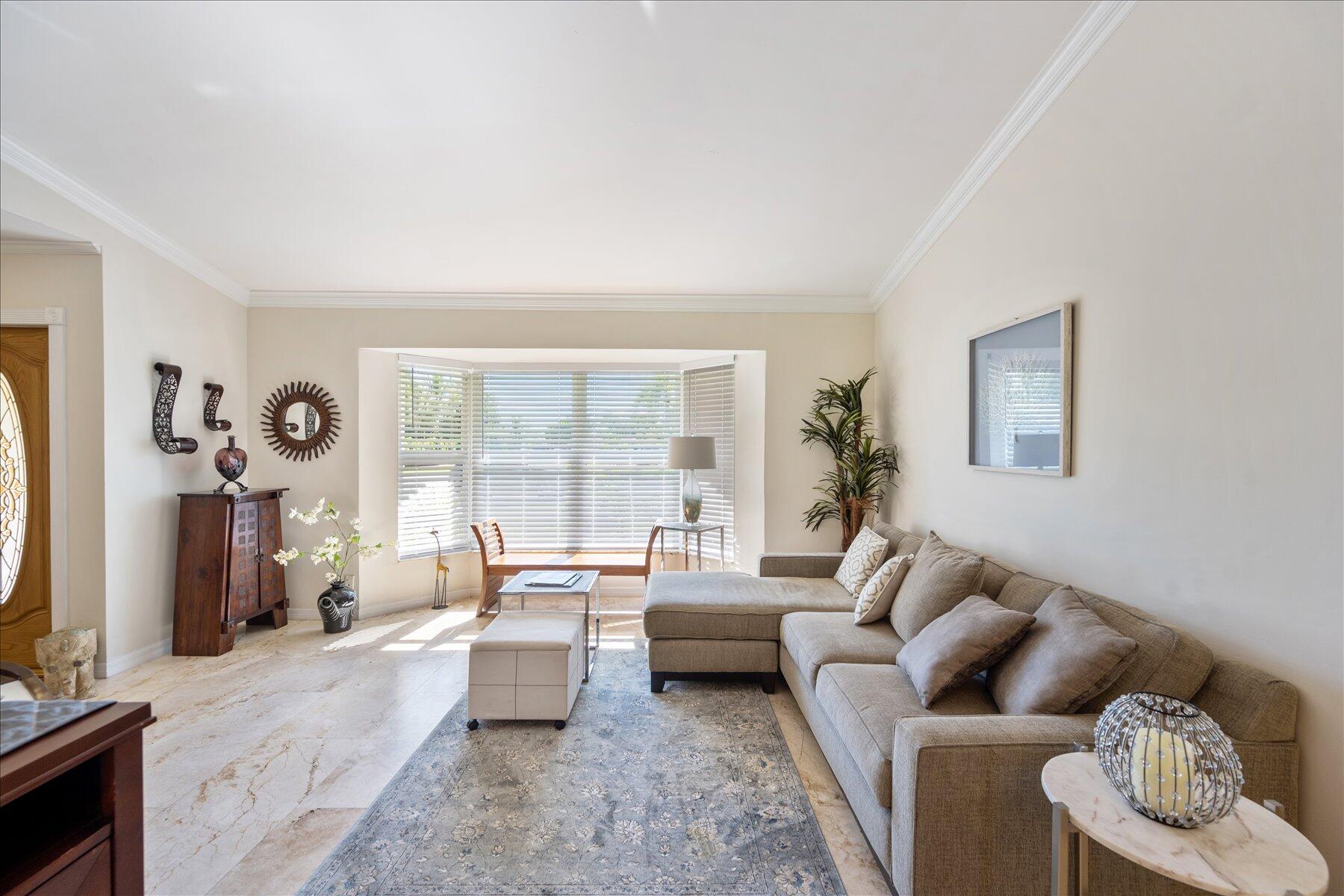 13889 Geranium Place Wellington, FL 33414 - Photo 6 of 32 a living room with furniture and a flat screen tv