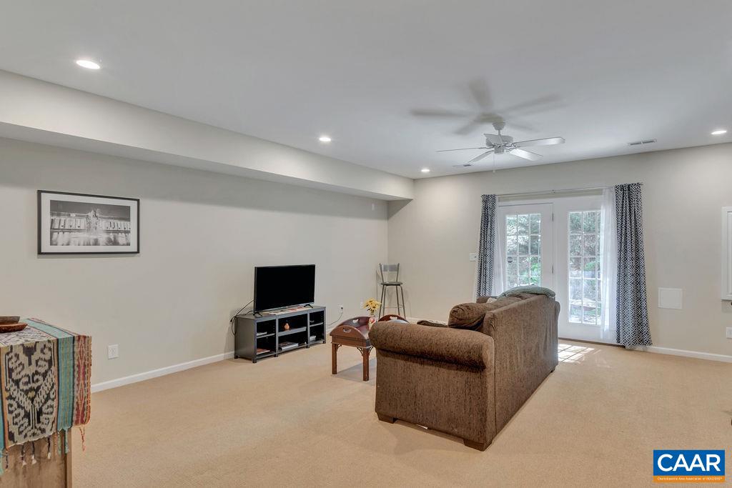 329 Quarry Road Charlottesville, VA 22902 - Photo 36 of 45 a living room with furniture and a flat screen tv