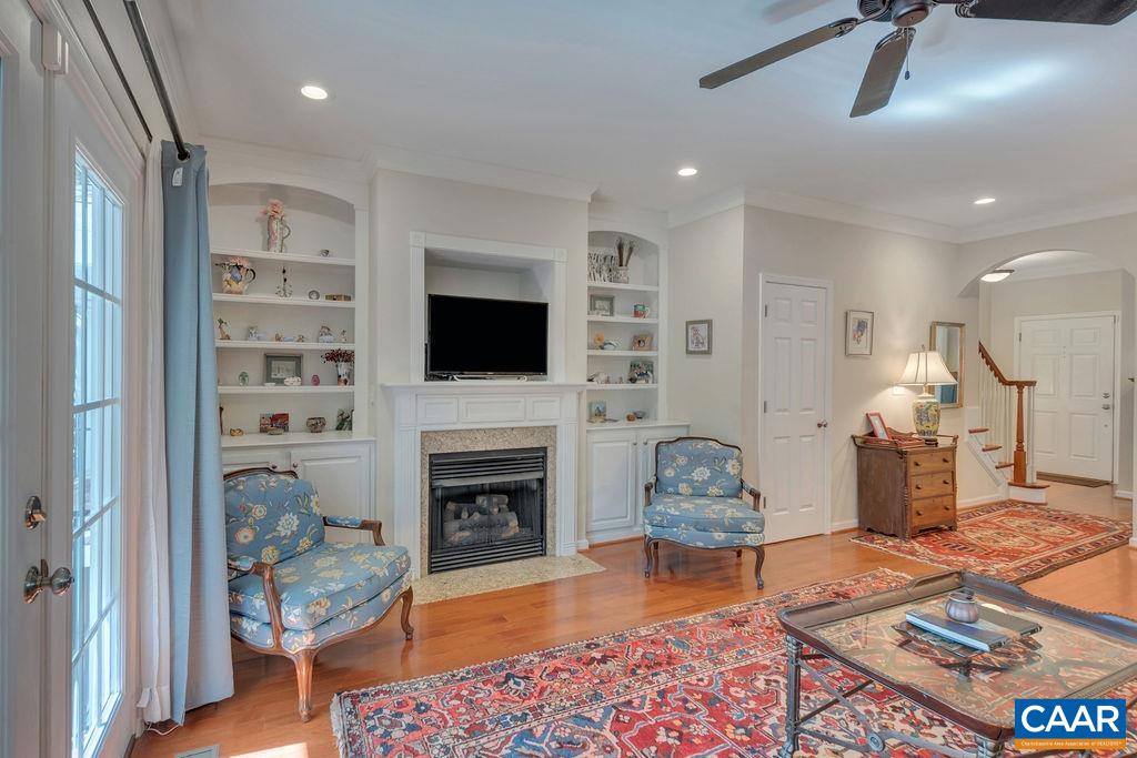 329 Quarry Road Charlottesville, VA 22902 - Photo 6 of 45 a living room with furniture a rug and a fireplace