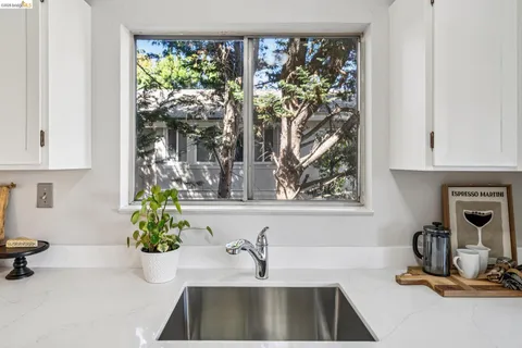 a kitchen with a sink and a window