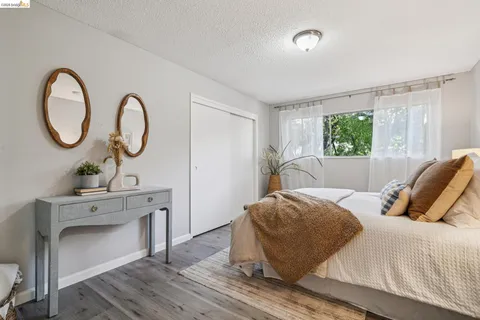 a bedroom with a bed and a table