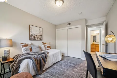 a bedroom with a bed and a table