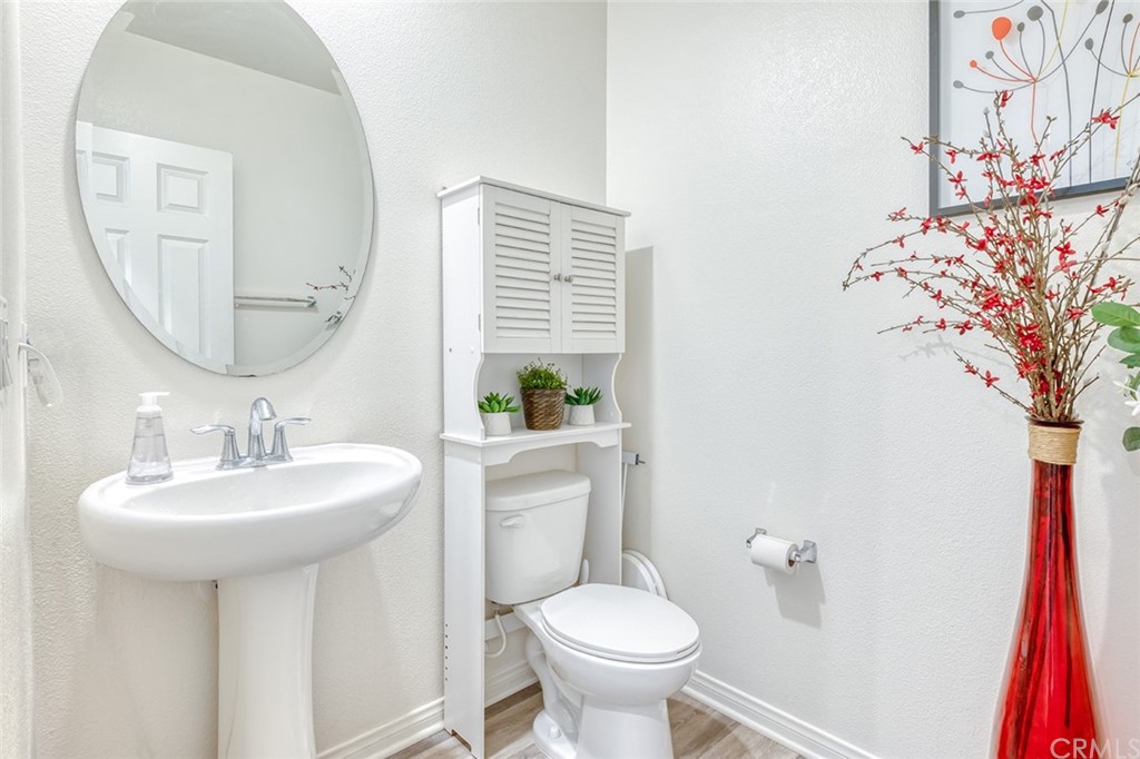8000 Olive Lane Downey, CA 90241 - Photo 12 of 39 a bathroom with a sink and a mirror