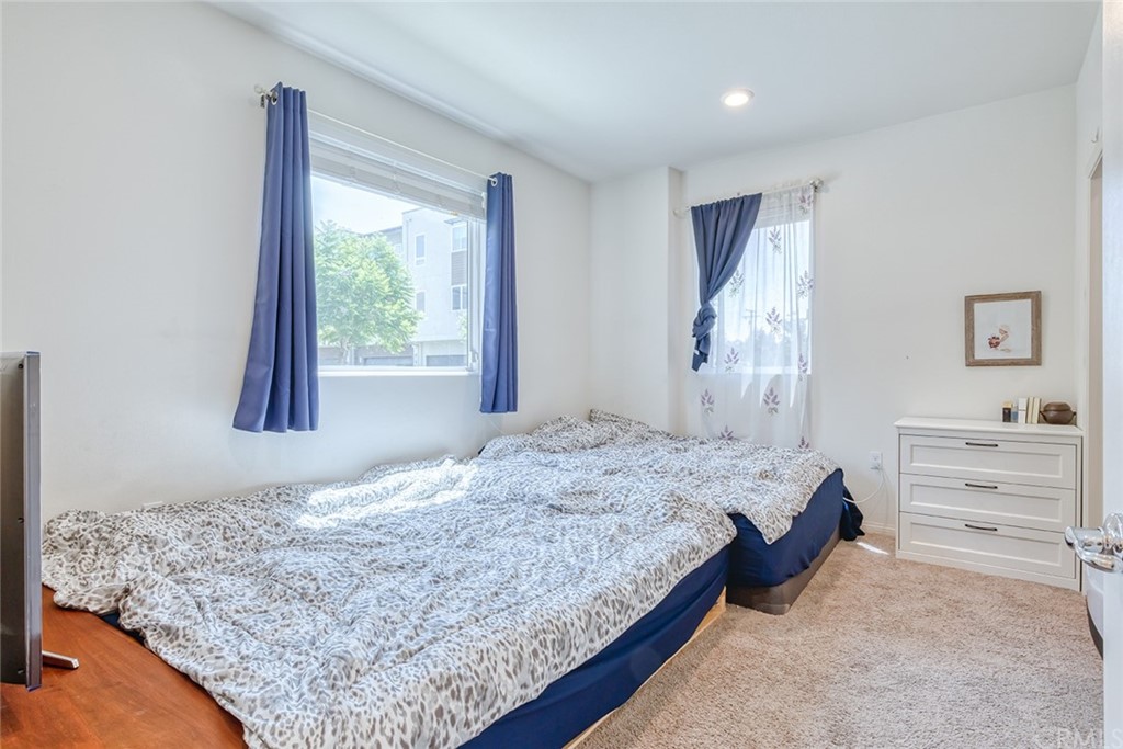 8000 Olive Lane Downey, CA 90241 - Photo 15 of 39 a bedroom with a bed and a window