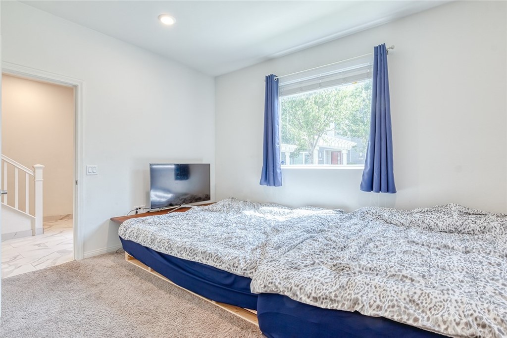 8000 Olive Lane Downey, CA 90241 - Photo 16 of 39 a bedroom with a bed and a window