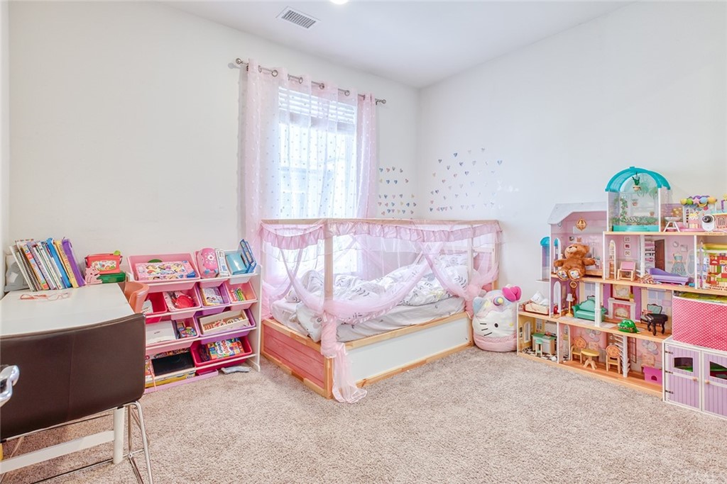 8000 Olive Lane Downey, CA 90241 - Photo 18 of 39 a living room with furniture and a rug