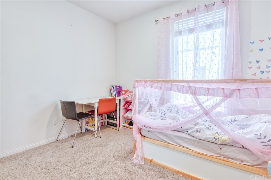 8000 Olive Lane Downey, CA 90241 - Photo 19 of 39 a view of a room that has a bed and chair