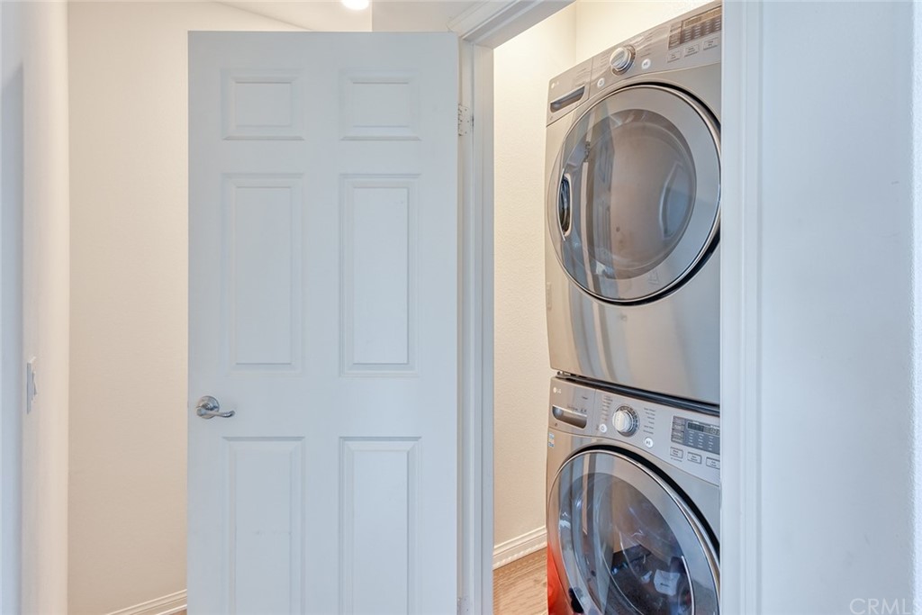 8000 Olive Lane Downey, CA 90241 - Photo 23 of 39 a view of a hallway with washer and dryer