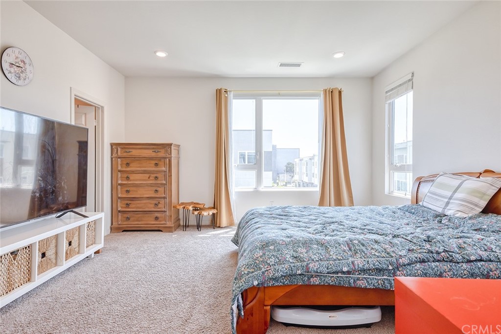 8000 Olive Lane Downey, CA 90241 - Photo 26 of 39 a living room with furniture and a flat screen tv