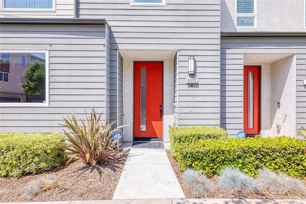 8000 Olive Lane Downey, CA 90241 - Photo 29 of 39 a front view of a house with a yard