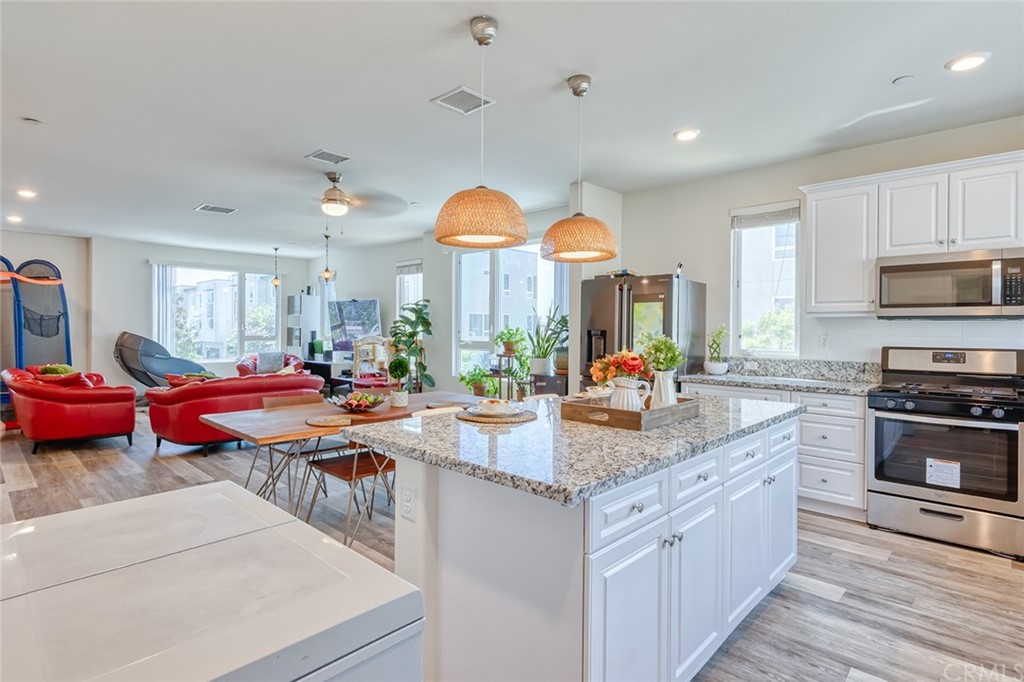 8000 Olive Lane Downey, CA 90241 - Photo 3 of 39 a kitchen with lots of counter top space