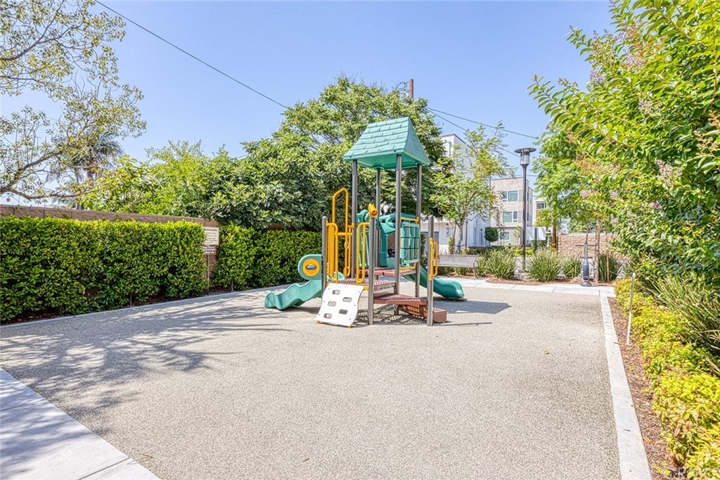 8000 Olive Lane Downey, CA 90241 - Photo 34 of 39 a view of a park with a bench and trees around