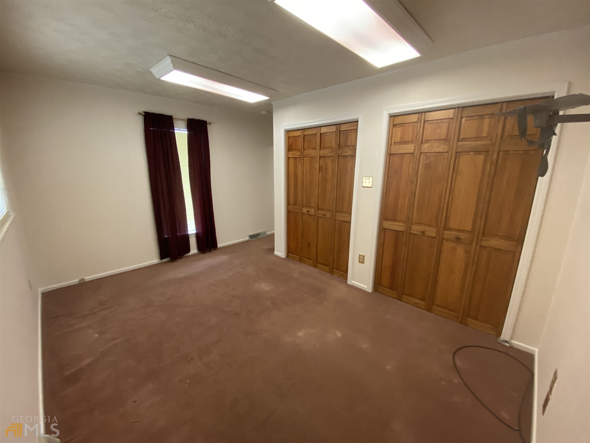 13 Carolina Street Hartwell, GA 30643 - Photo 5 of 5 a view of a closet with wooden floor