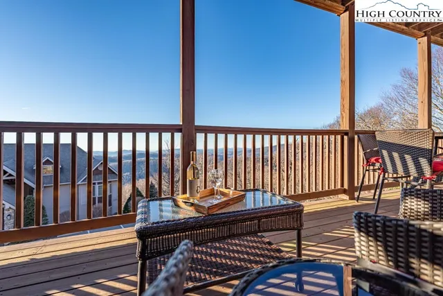 a view of a balcony with chairs