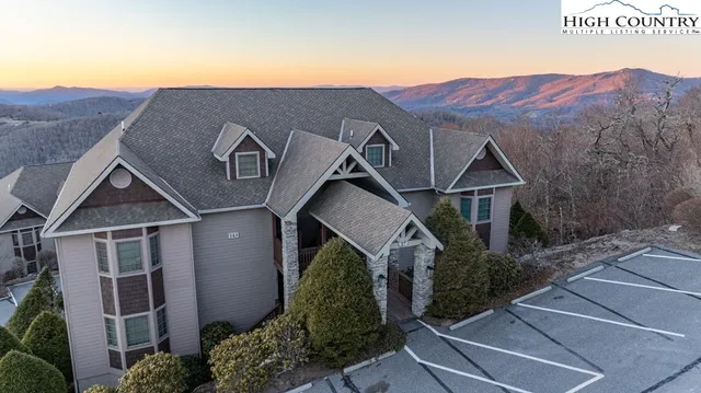 a front view of a house with a street