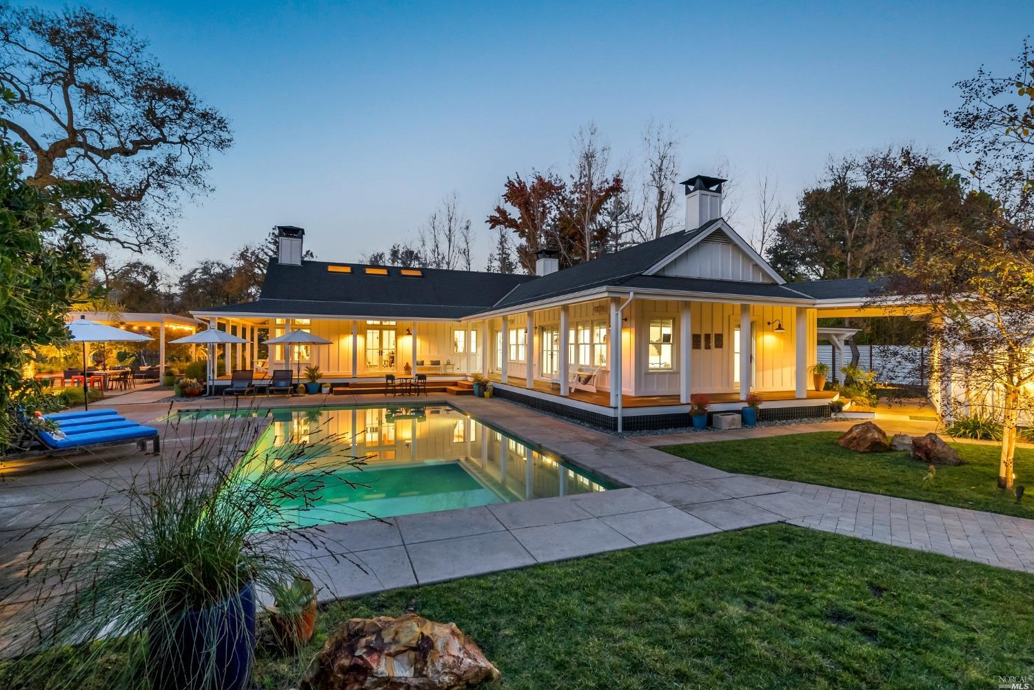 swimming pool view with a seating space