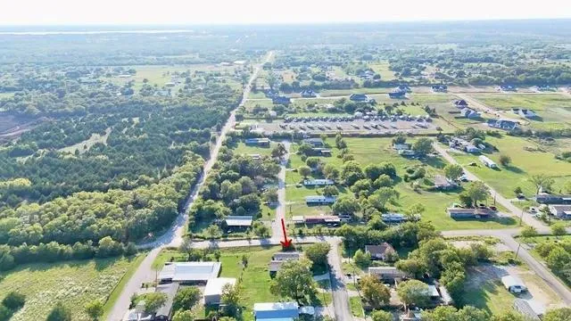 an aerial view of residential building and lake