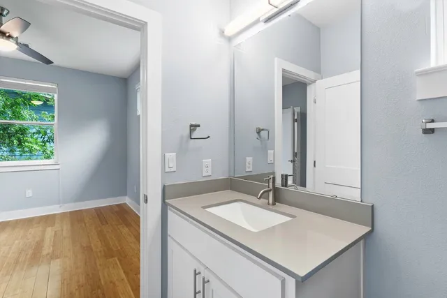 a bathroom with a sink and a mirror