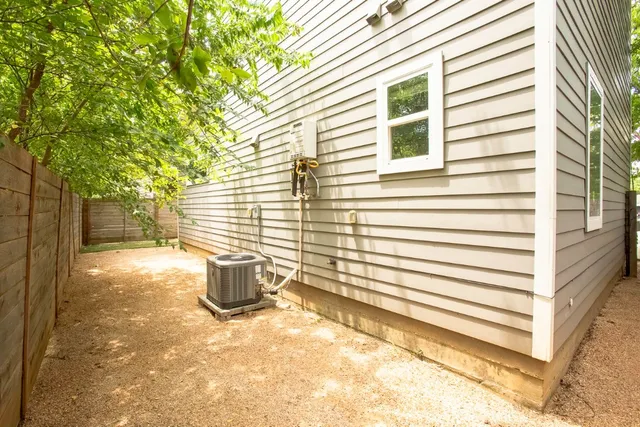 a view of a backyard with a chair and the door