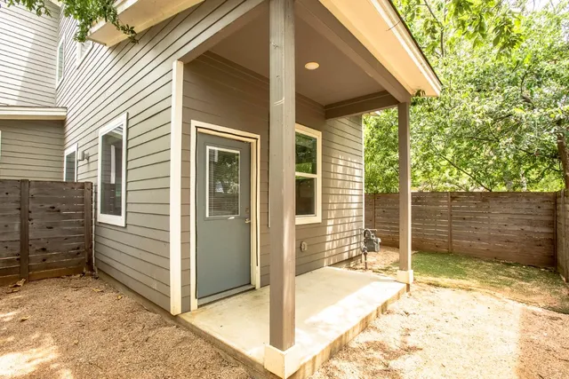 a backyard of a house with seating space
