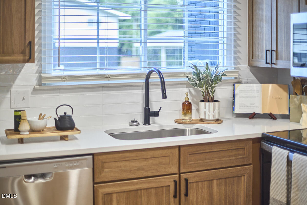 2613 McNeil Street, Unit B Raleigh, NC 27608 - Photo 17 of 31 a kitchen with a sink and a window