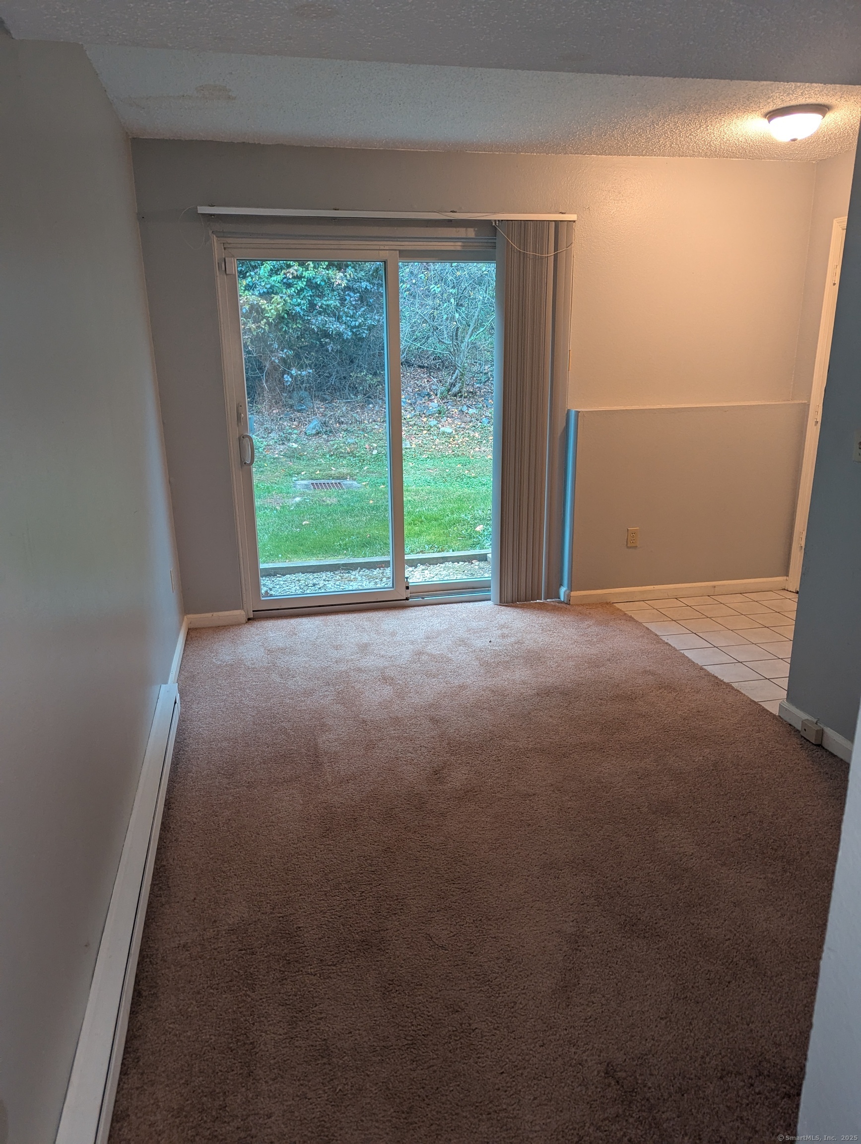 925 Oronoke Road, Unit 38F Waterbury, CT 06708 - Photo 13 of 15 a view of an empty room with large windows