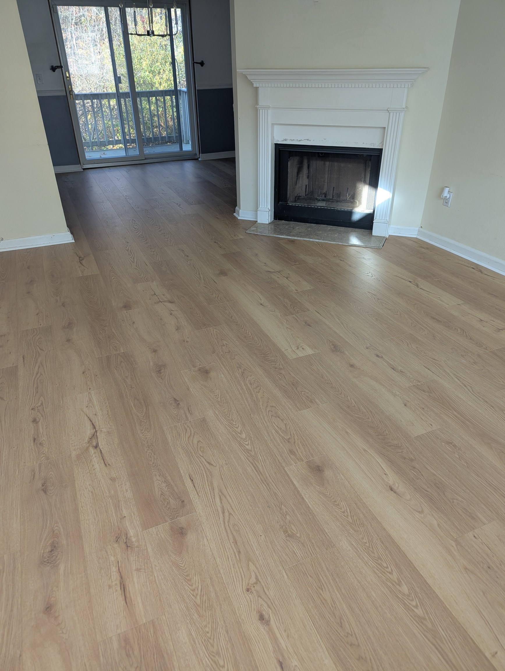 925 Oronoke Road, Unit 38F Waterbury, CT 06708 - Photo 6 of 15 an empty room with fireplace and wooden floor