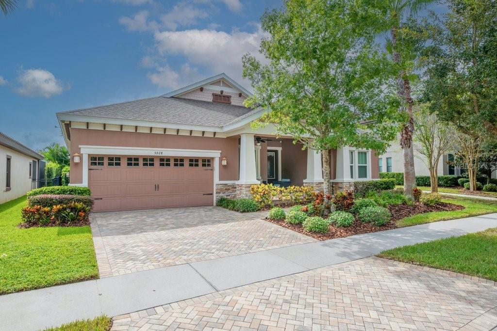 5928 Shell Ridge Drive Lithia, FL 33547 - Photo 1 of 1 a front view of a house with a yard and garage