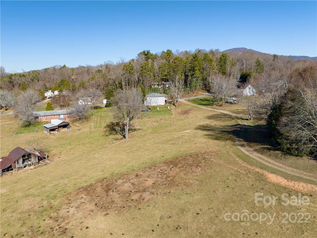 0 Old Clyde Road Clyde, NC 28721 - Photo 16 of 17 a view of a town with mountains in the background