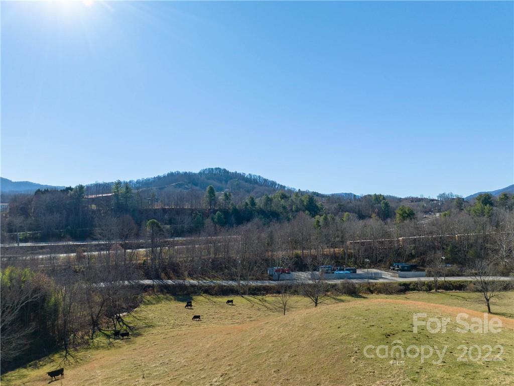0 Old Clyde Road Clyde, NC 28721 - Photo 5 of 17 a view of a lake with a mountain view
