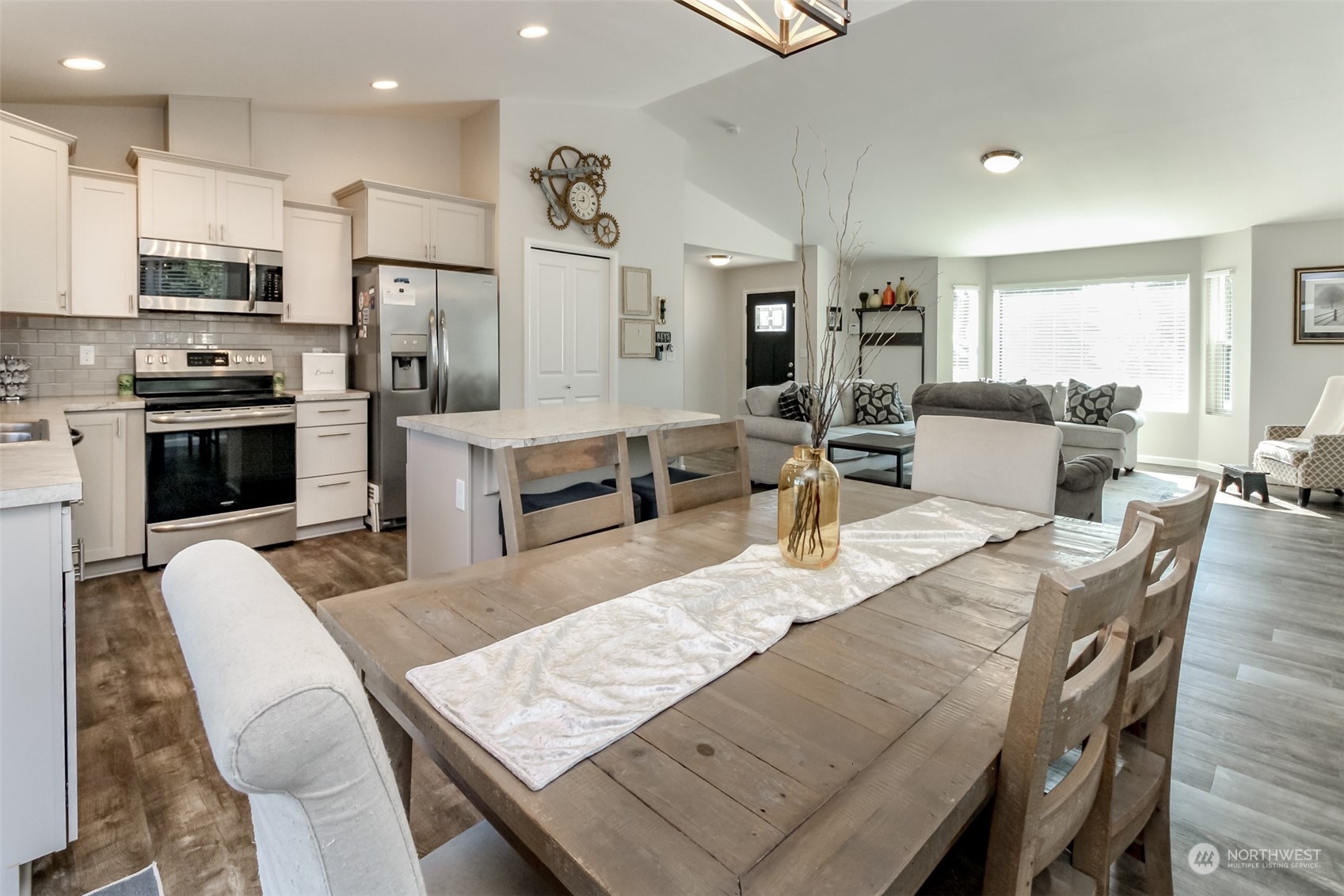 18217 Lawton Lane Southwest Rochester, WA 98579 - Photo 12 of 40 a living room with stainless steel appliances furniture dining table and chairs