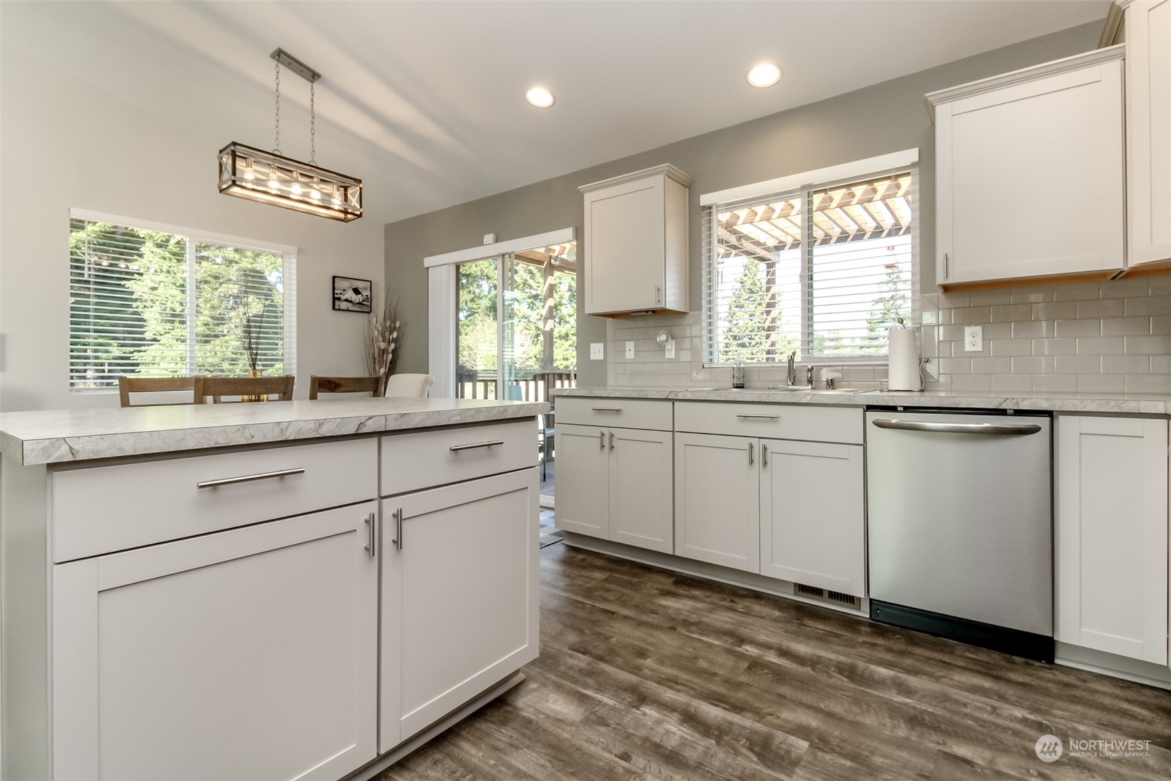18217 Lawton Lane Southwest Rochester, WA 98579 - Photo 14 of 40 a kitchen with a sink cabinets appliances and a window