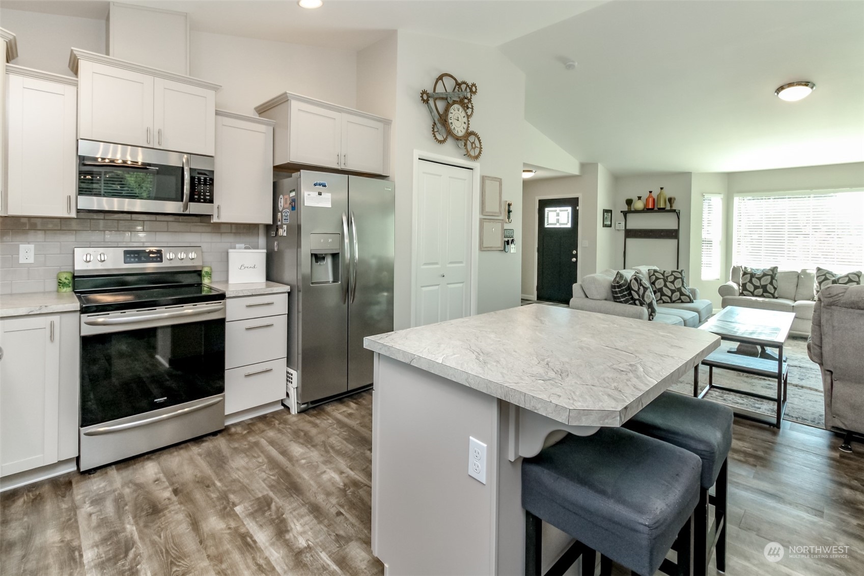 18217 Lawton Lane Southwest Rochester, WA 98579 - Photo 15 of 40 a kitchen with stainless steel appliances granite countertop a stove refrigerator and a stove