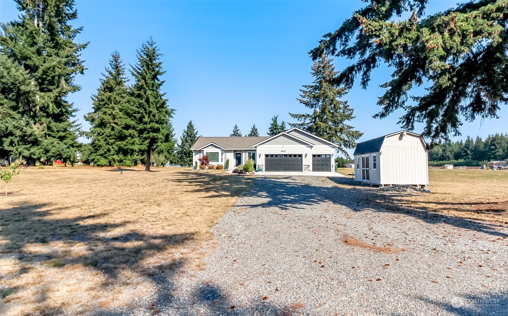 18217 Lawton Lane Southwest Rochester, WA 98579 - Photo 2 of 40 a view of white house with a yard