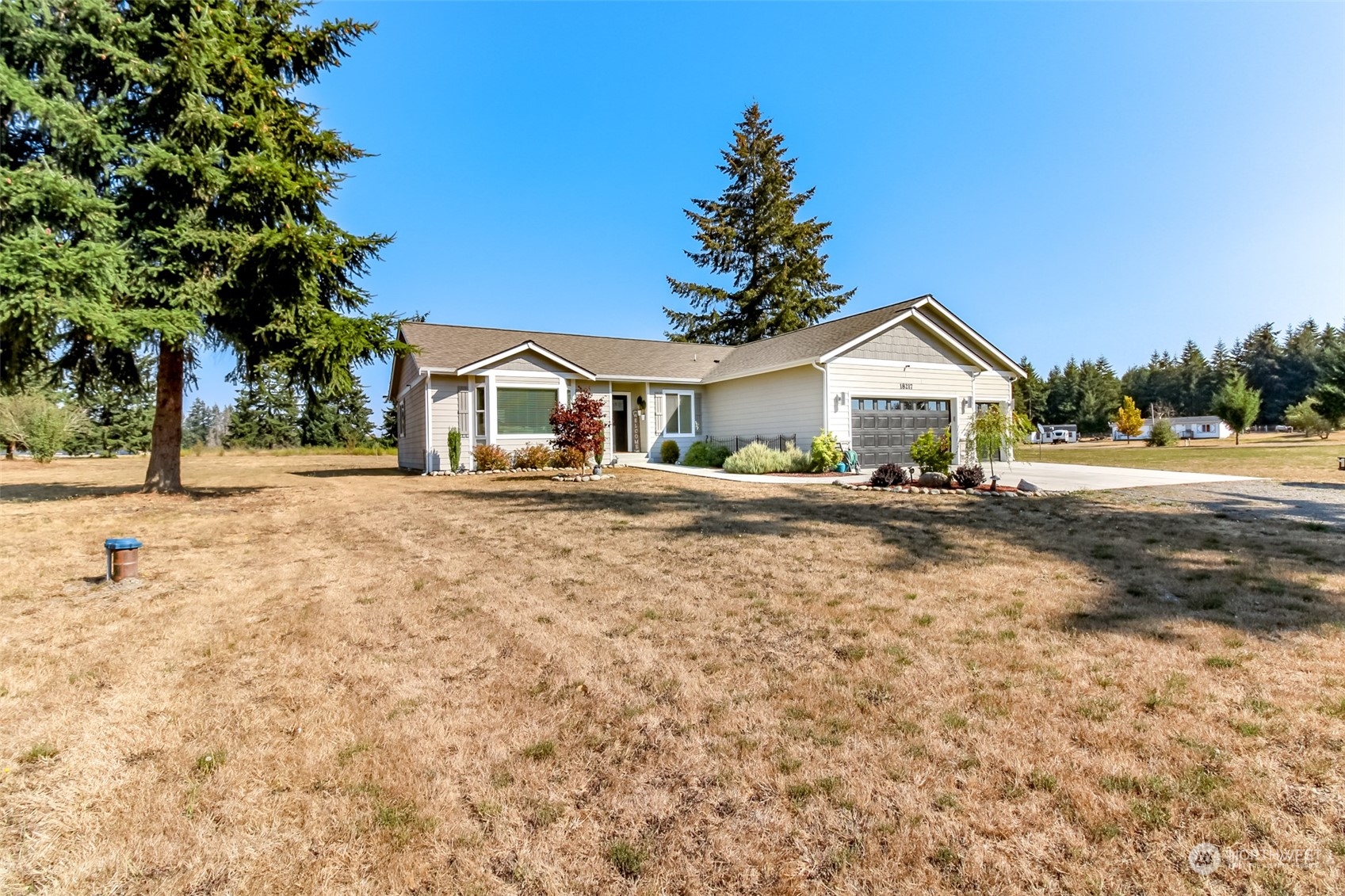 18217 Lawton Lane Southwest Rochester, WA 98579 - Photo 31 of 40 a front view of a house with a yard