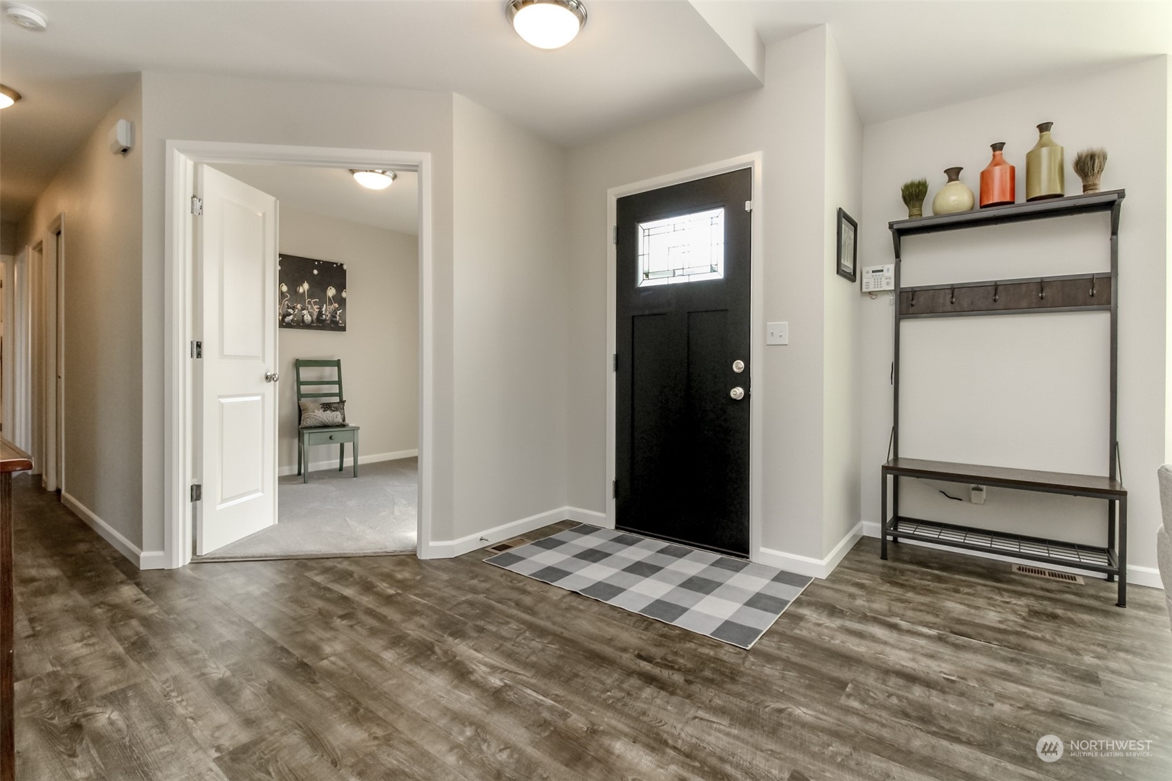 18217 Lawton Lane Southwest Rochester, WA 98579 - Photo 7 of 40 a view of a livingroom with wooden floor and closet