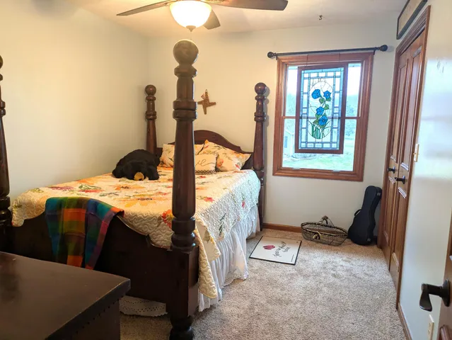 a bed room with a bed and a window