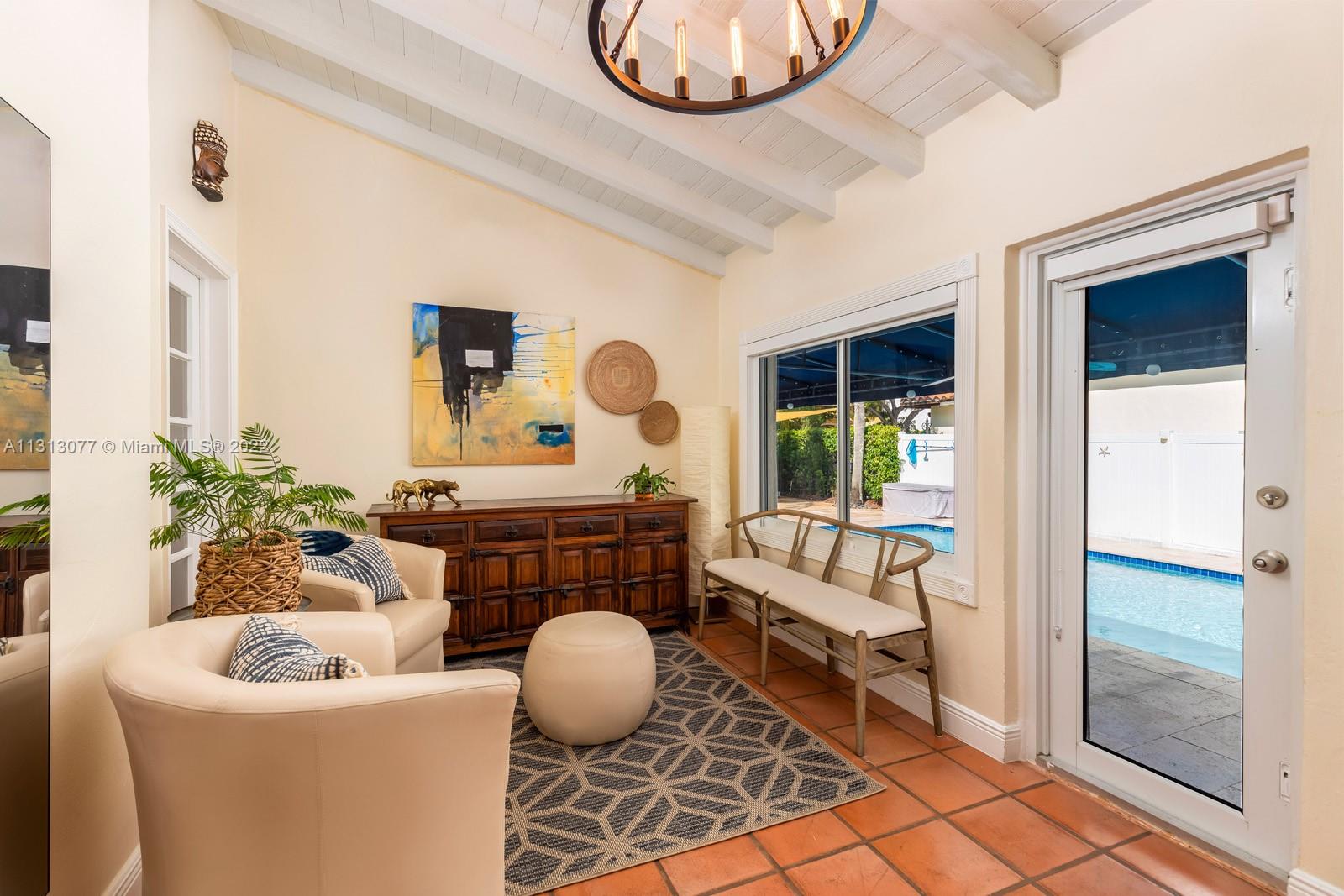 625 Southwest 27th Road Miami, FL 33129 - Photo 11 of 29 a living room with furniture a window and a potted plant