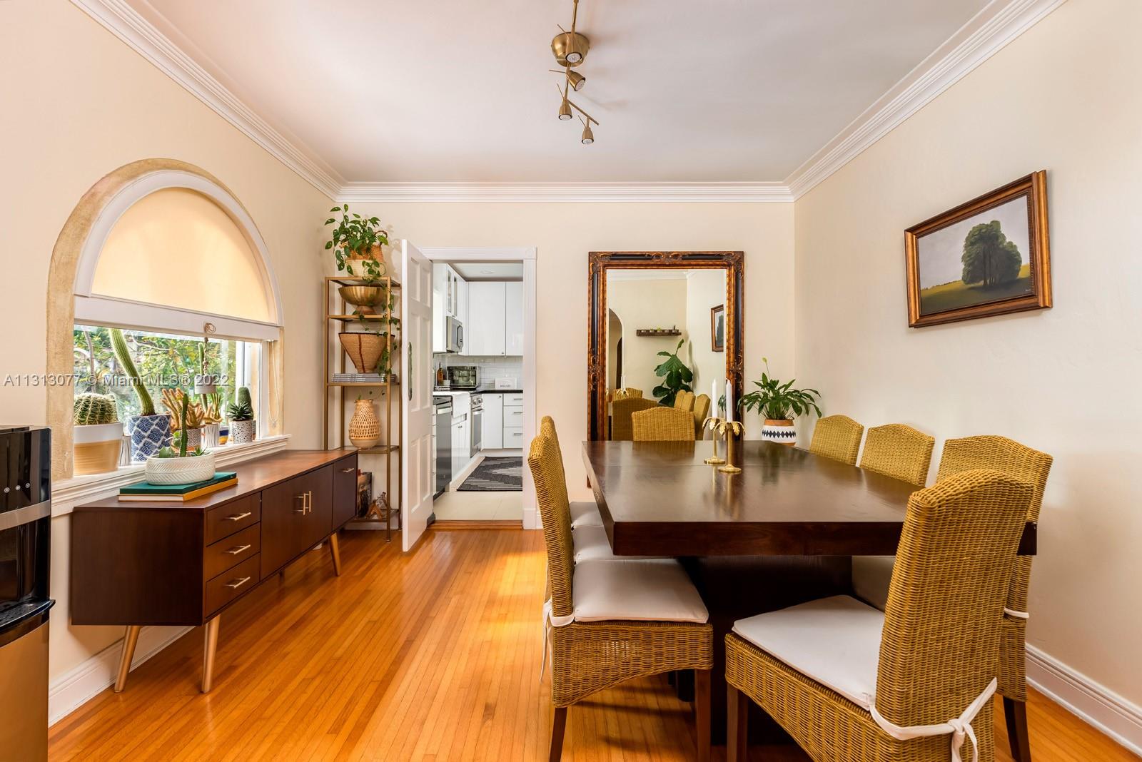 625 Southwest 27th Road Miami, FL 33129 - Photo 8 of 29 a view of a dining room with furniture window and wooden floor