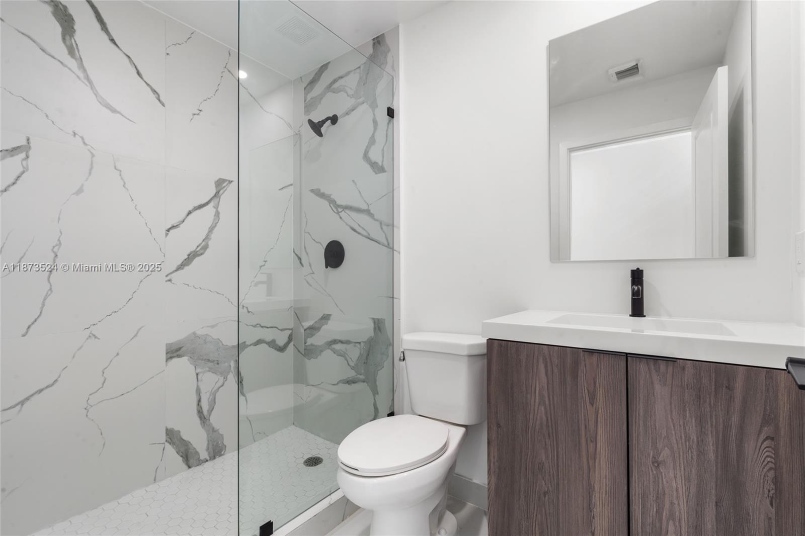 14530 Southwest 261st Terrace, Unit 2 Homestead, FL 33032 - Photo 14 of 23 a bathroom with a granite countertop sink toilet and shower