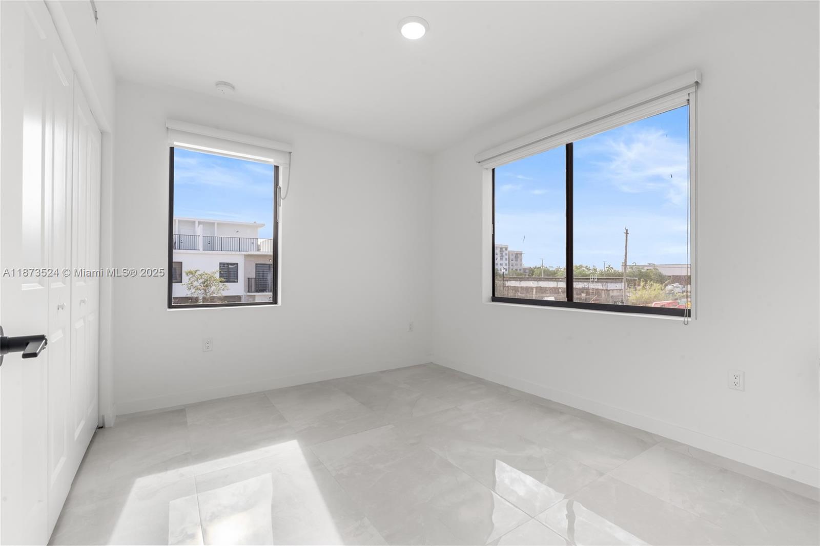 14530 Southwest 261st Terrace, Unit 2 Homestead, FL 33032 - Photo 15 of 23 a view of an empty room with a window