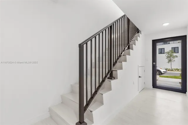 a view of a hallway with staircase