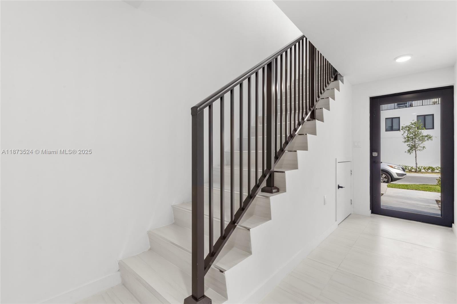 14530 Southwest 261st Terrace, Unit 2 Homestead, FL 33032 - Photo 18 of 23 a view of a hallway with staircase