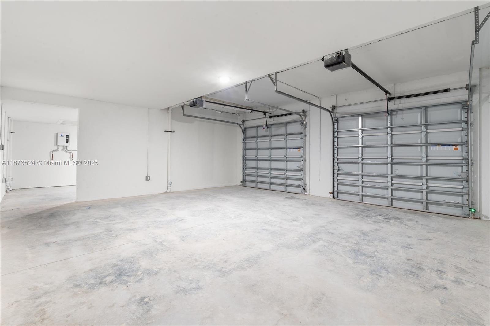 14530 Southwest 261st Terrace, Unit 2 Homestead, FL 33032 - Photo 20 of 23 a view of a garage