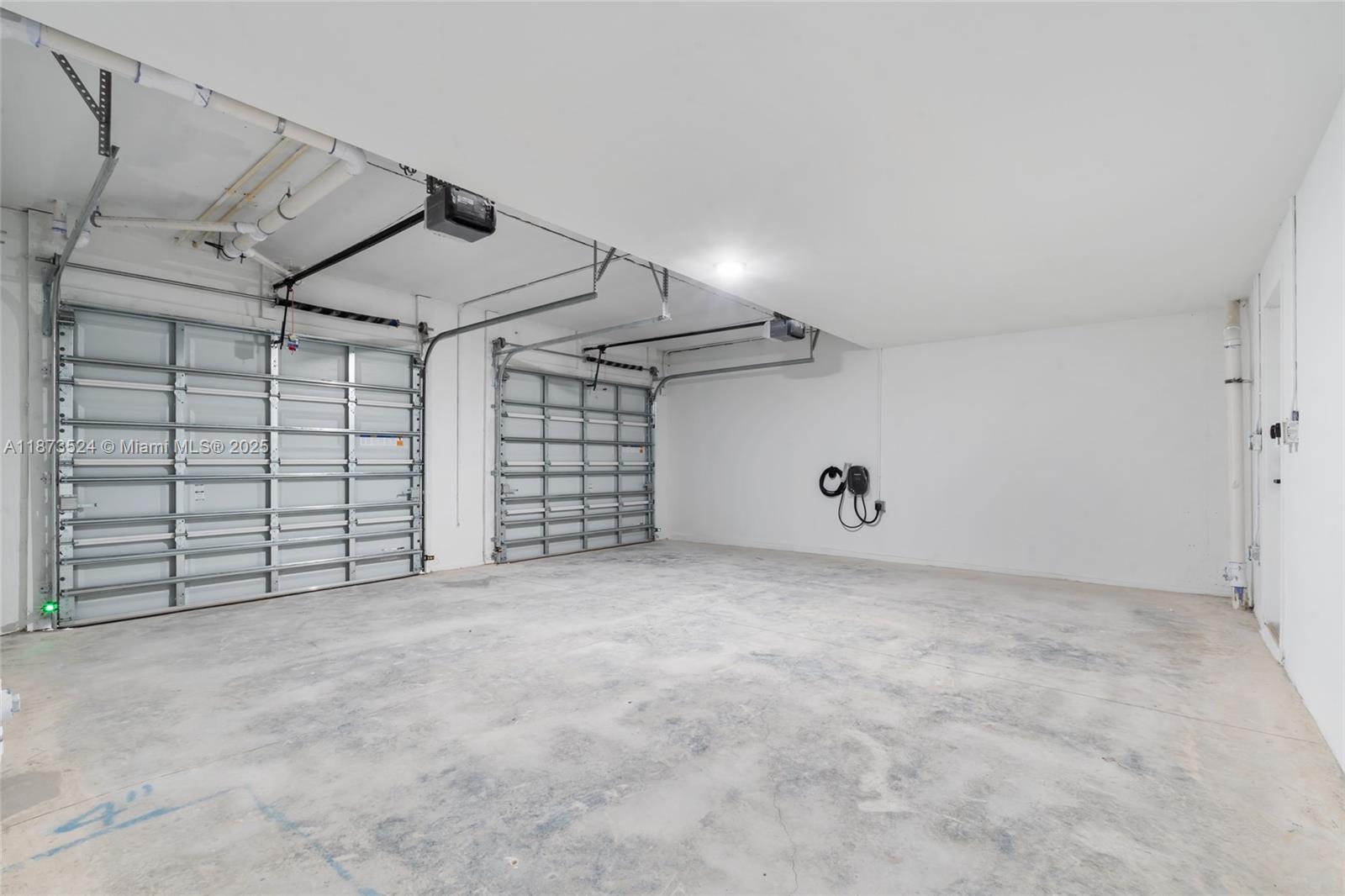 14530 Southwest 261st Terrace, Unit 2 Homestead, FL 33032 - Photo 21 of 23 a view of a garage