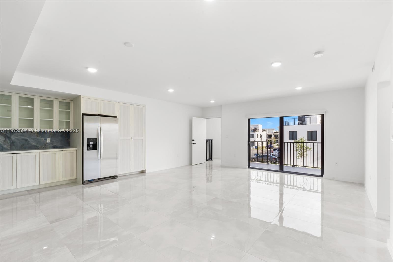 14530 Southwest 261st Terrace, Unit 2 Homestead, FL 33032 - Photo 4 of 23 an empty room with windows and closet