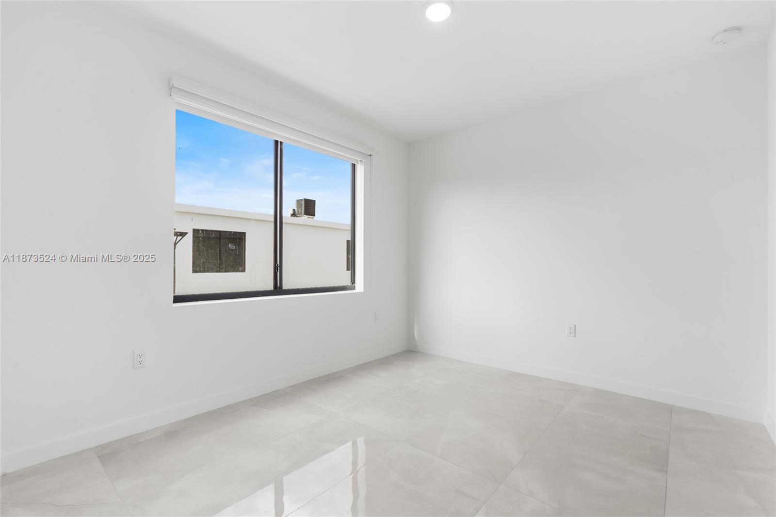 14530 Southwest 261st Terrace, Unit 2 Homestead, FL 33032 - Photo 8 of 23 a view of an empty room