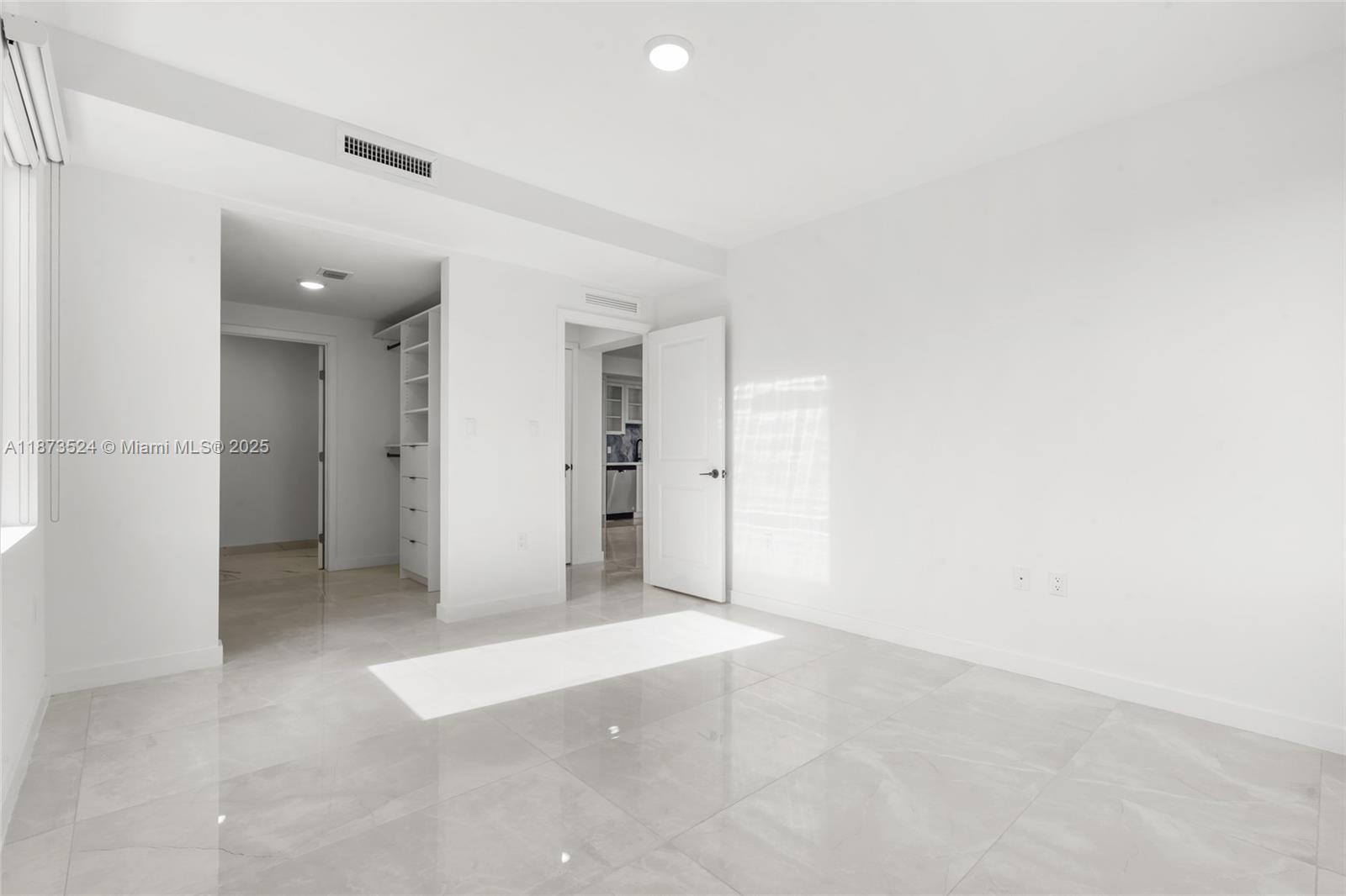 14530 Southwest 261st Terrace, Unit 2 Homestead, FL 33032 - Photo 9 of 23 an empty room with closet and a bathroom