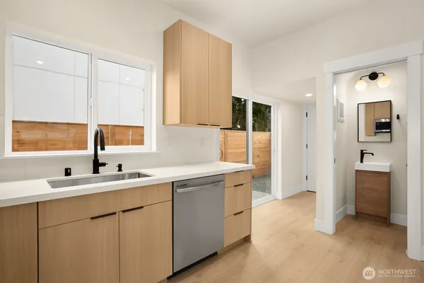 a kitchen with a sink and cabinets