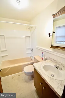 a bathroom with a sink and a bathtub